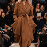 Céline Dion Wore an Asymmetric Caramel Alaïa Trench Coat and Cutout Suede Boots in Paris